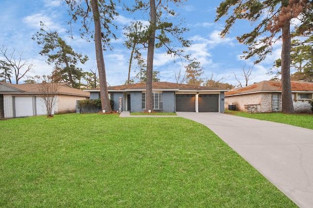 ranch-style house with a garage and a front lawn