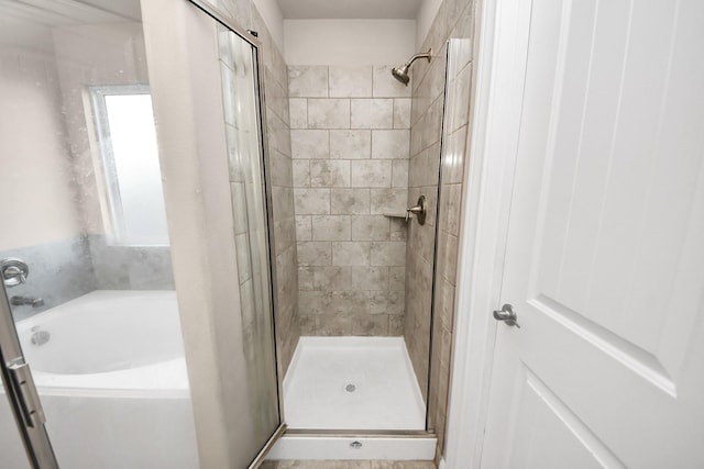 bathroom featuring plus walk in shower