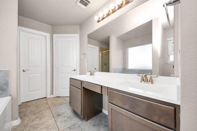 bathroom featuring vanity, tile patterned flooring, and independent shower and bath