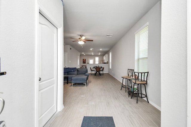 hallway featuring light wood-type flooring