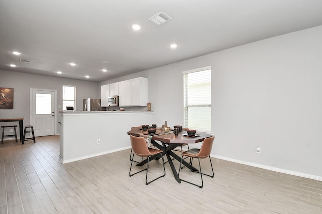 dining area featuring light hardwood / wood-style flooring