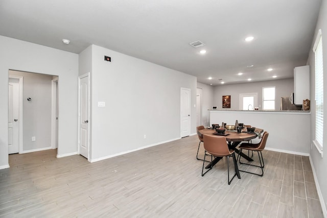 dining room with light hardwood / wood-style flooring