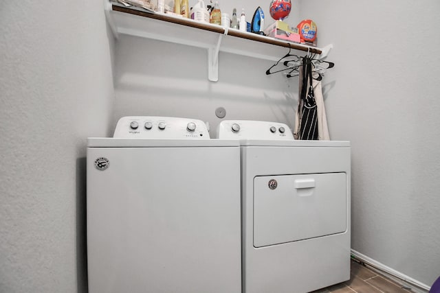 clothes washing area with independent washer and dryer