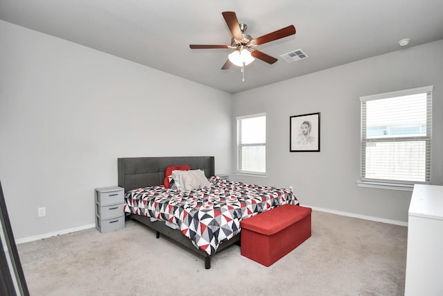 bedroom with ceiling fan and carpet flooring