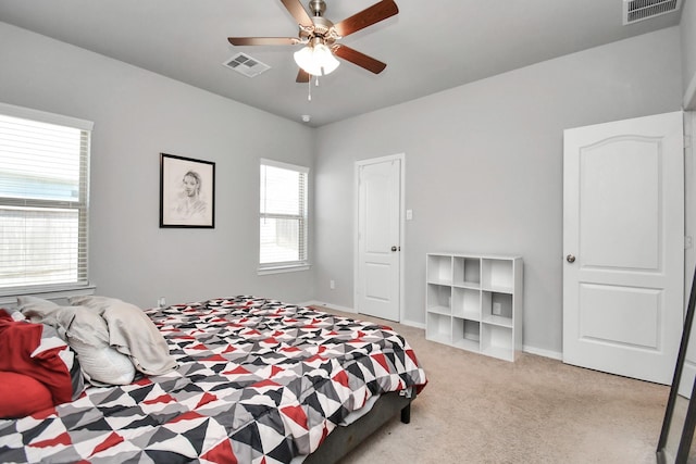 bedroom featuring ceiling fan and light colored carpet