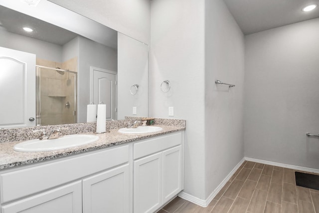 bathroom with vanity and walk in shower