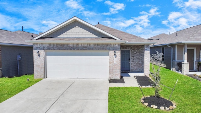 view of front of property featuring a garage and a front lawn