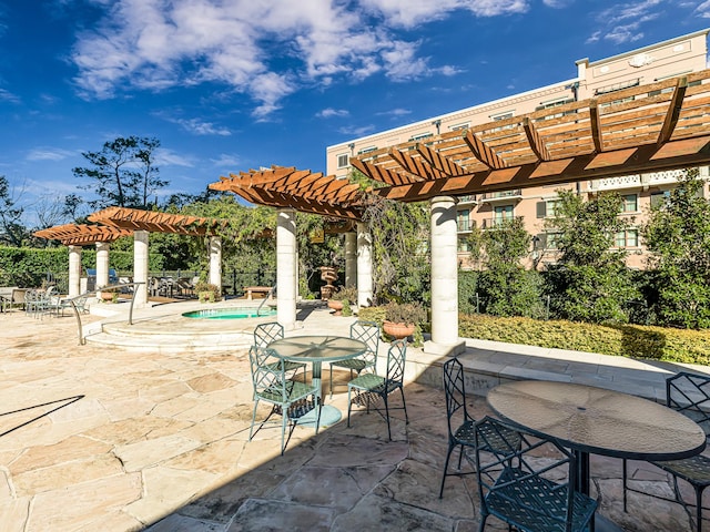 view of patio with a pool and a pergola