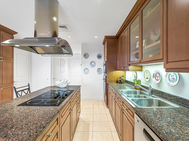 kitchen with sink, island range hood, light tile patterned floors, black electric cooktop, and dark stone counters