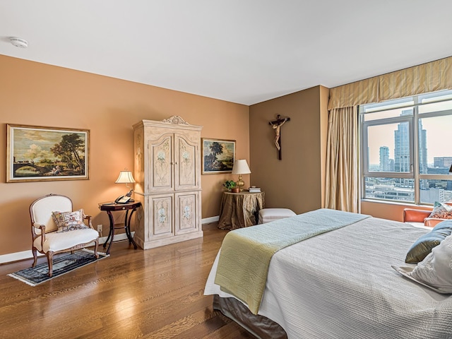 bedroom with hardwood / wood-style floors