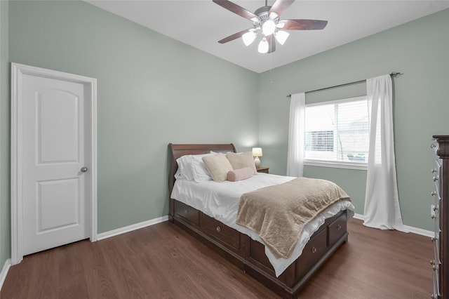 bedroom with dark hardwood / wood-style floors and ceiling fan