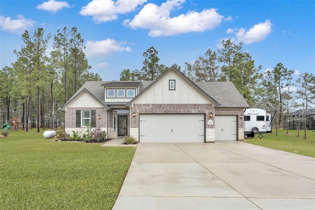 view of front of house with a garage and a front yard