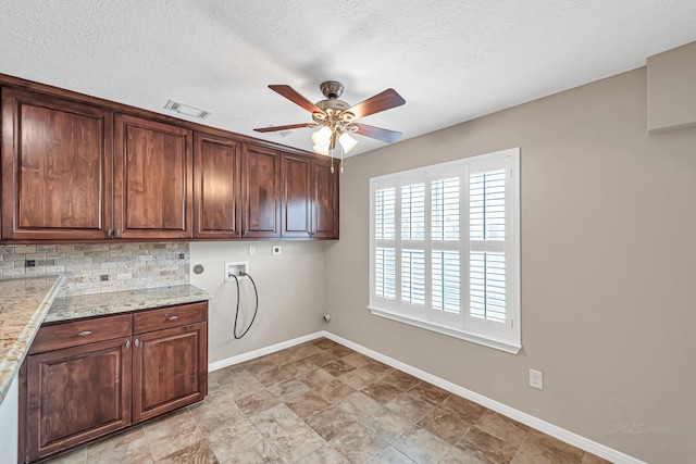 clothes washing area with cabinets, hookup for a gas dryer, ceiling fan, hookup for a washing machine, and hookup for an electric dryer