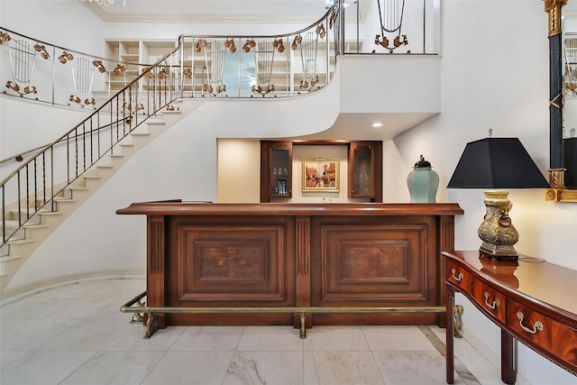 interior space with stairway and a high ceiling