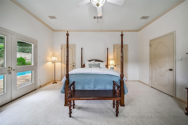 carpeted bedroom with baseboards, visible vents, french doors, and ornamental molding