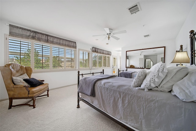 bedroom featuring carpet, visible vents, ceiling fan, and baseboards