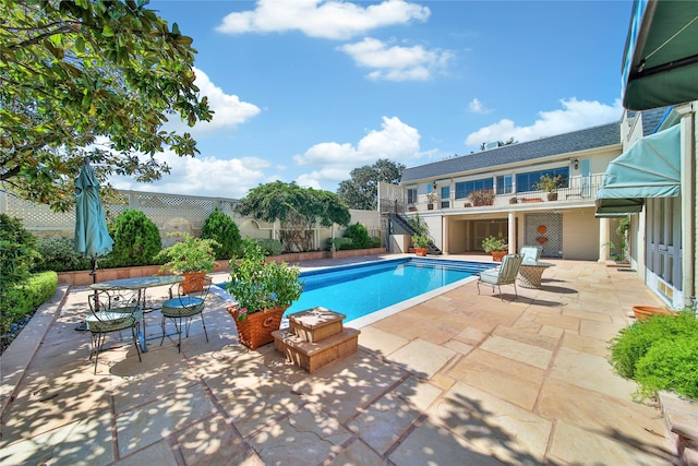 view of pool with a patio, a fenced backyard, and a fenced in pool