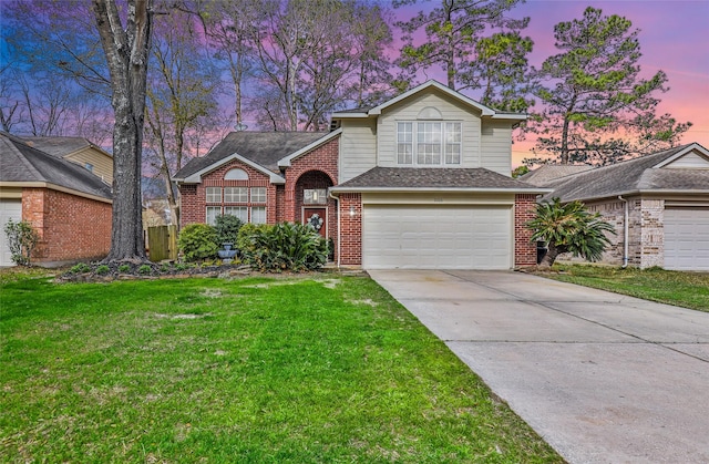 traditional-style house with brick siding, a front lawn, concrete driveway, roof with shingles, and an attached garage