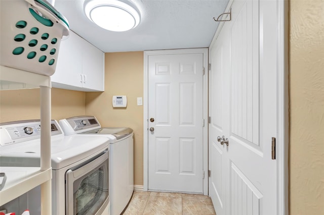 laundry area with washer and dryer and cabinet space