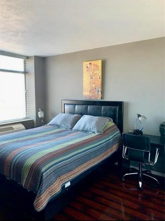 bedroom featuring wood-type flooring