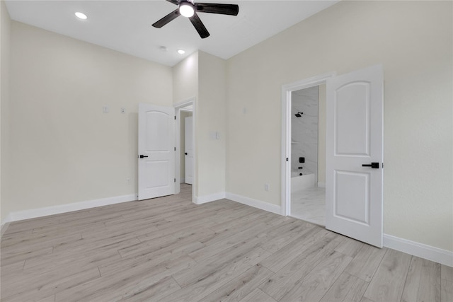 unfurnished room featuring ceiling fan and light hardwood / wood-style floors