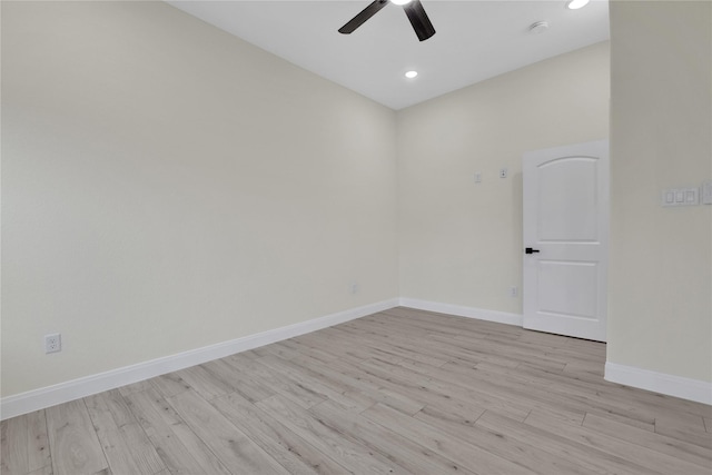 spare room featuring ceiling fan and light hardwood / wood-style floors