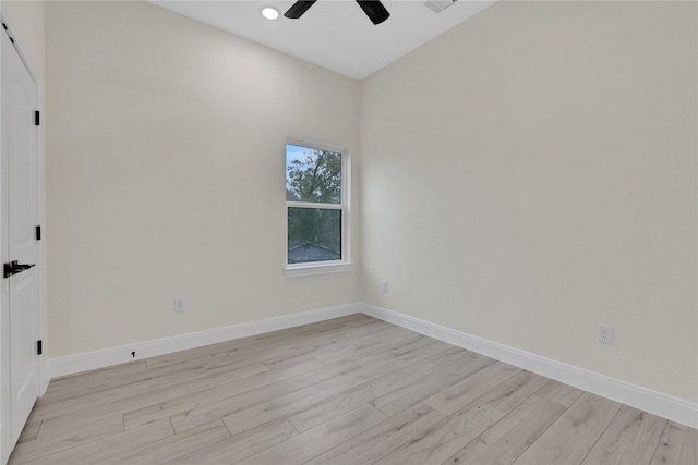 unfurnished room with ceiling fan and light wood-type flooring