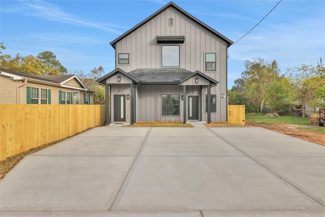 rear view of property featuring a patio area