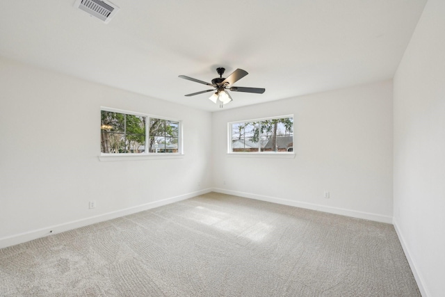 unfurnished room featuring ceiling fan and carpet floors