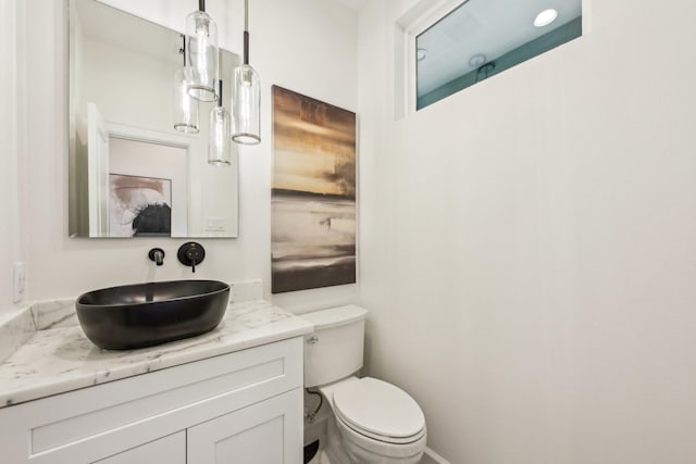 bathroom with vanity and toilet