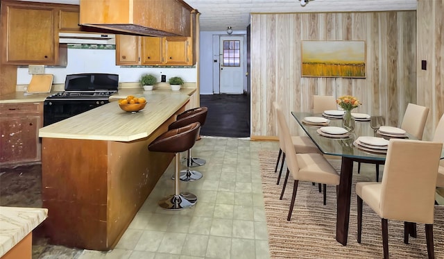 kitchen featuring black gas range oven