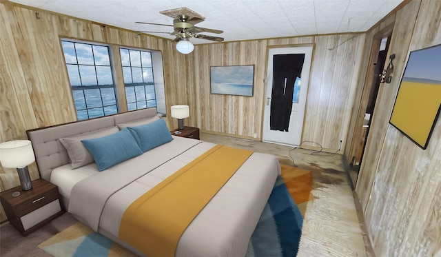 bedroom with ceiling fan and wood walls