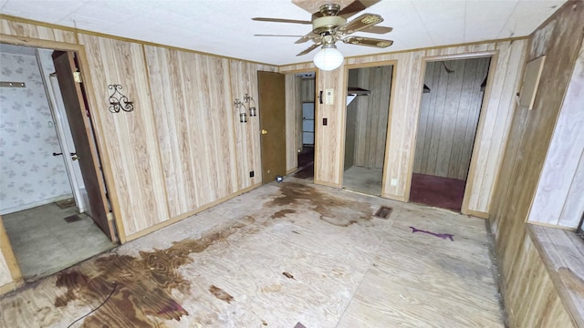 interior space with ornamental molding and two closets