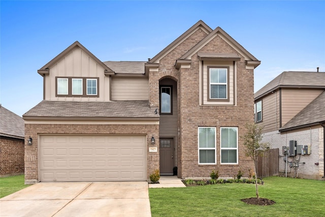 view of front facade with a garage and a front yard