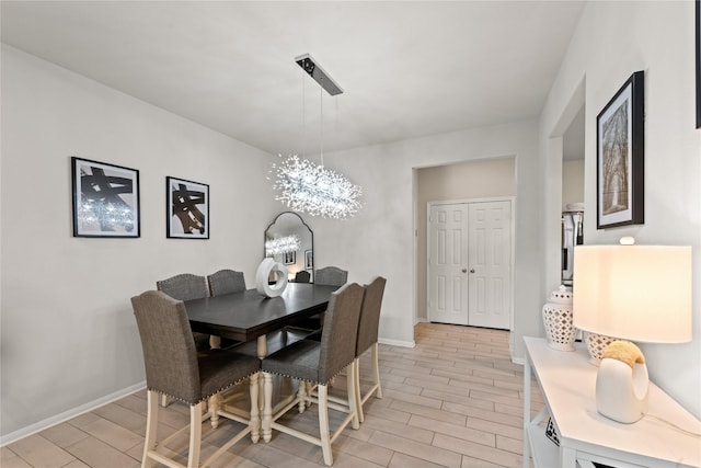 dining room with a notable chandelier