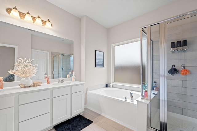 bathroom featuring vanity, tile patterned flooring, and independent shower and bath