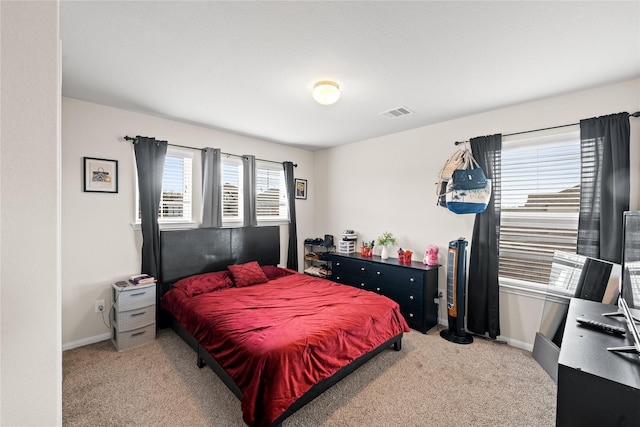 bedroom with light carpet