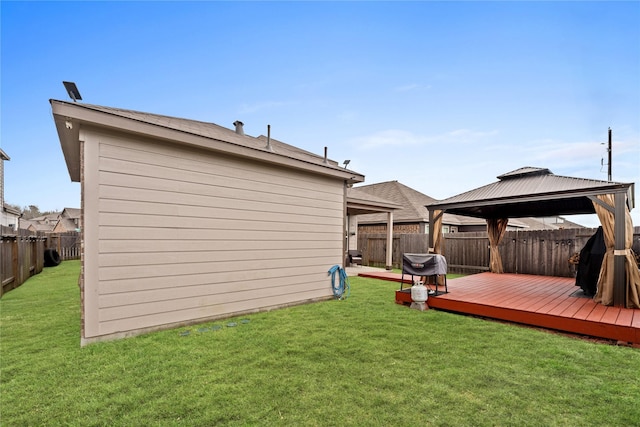 view of yard featuring a gazebo and a wooden deck