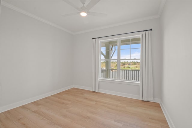 unfurnished room featuring light wood finished floors, a ceiling fan, baseboards, and crown molding