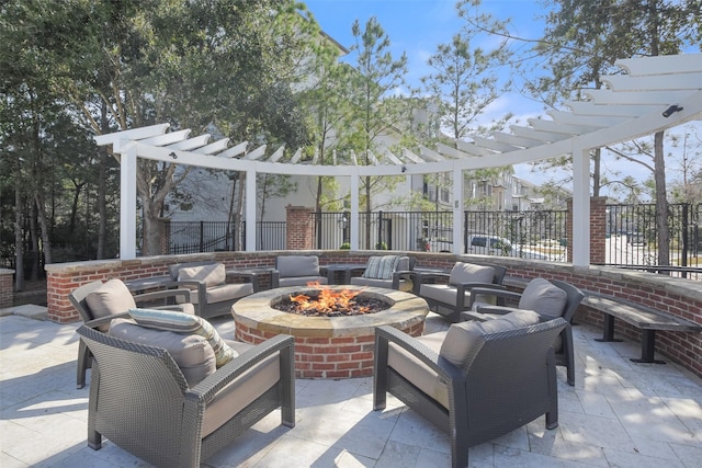 view of patio / terrace featuring fence, a pergola, and an outdoor living space with a fire pit