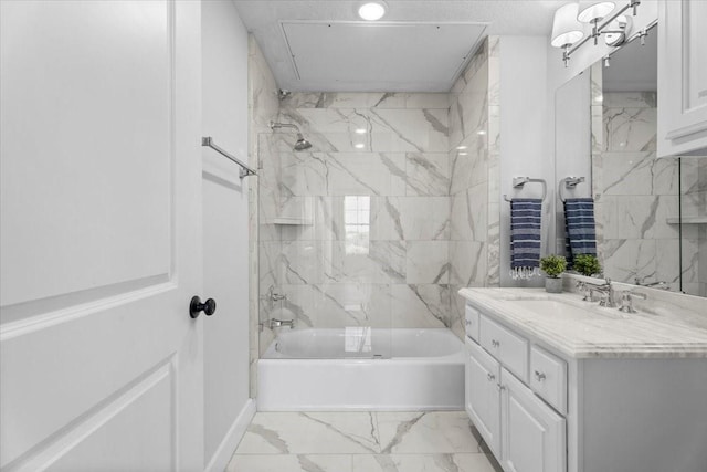 bathroom featuring  shower combination, marble finish floor, and vanity