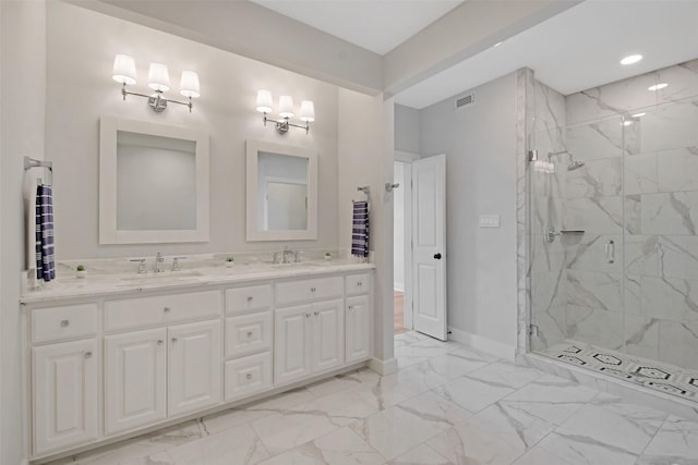 full bath featuring double vanity, a marble finish shower, visible vents, marble finish floor, and a sink