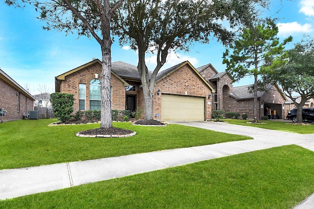 view of front facade featuring central AC unit, a garage, and a front yard