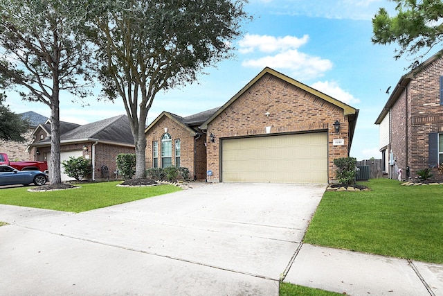 view of front of home with a garage and a front yard