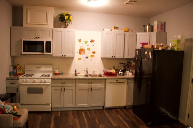 kitchen with white cabinetry, sink, dark wood-type flooring, and white appliances