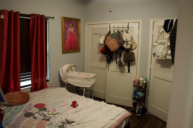 bedroom featuring dark hardwood / wood-style floors and a closet