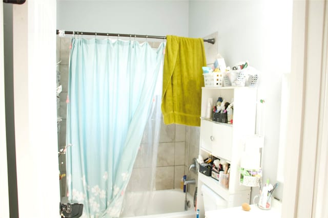 bathroom featuring shower / bath combination with curtain