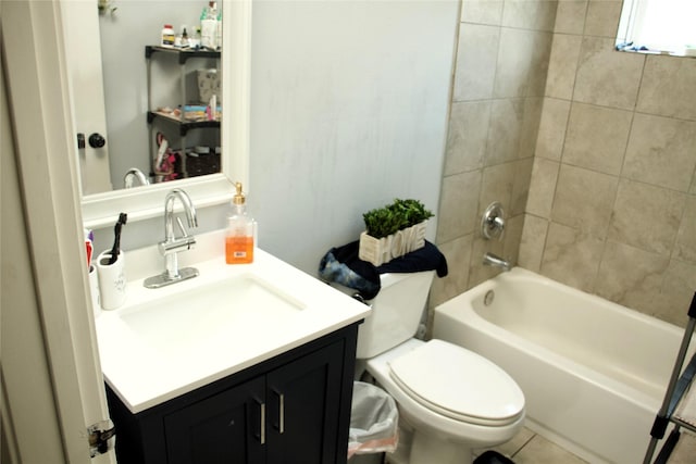 full bathroom with tiled shower / bath, vanity, and toilet