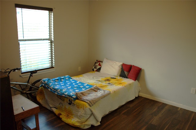 bedroom featuring dark hardwood / wood-style flooring