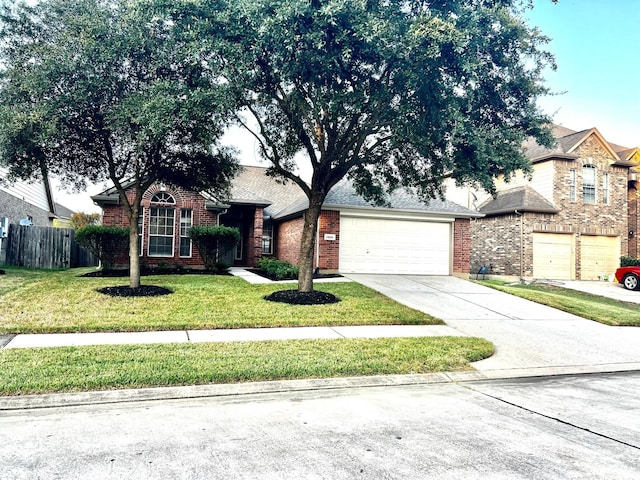 view of front of house with a garage and a front yard